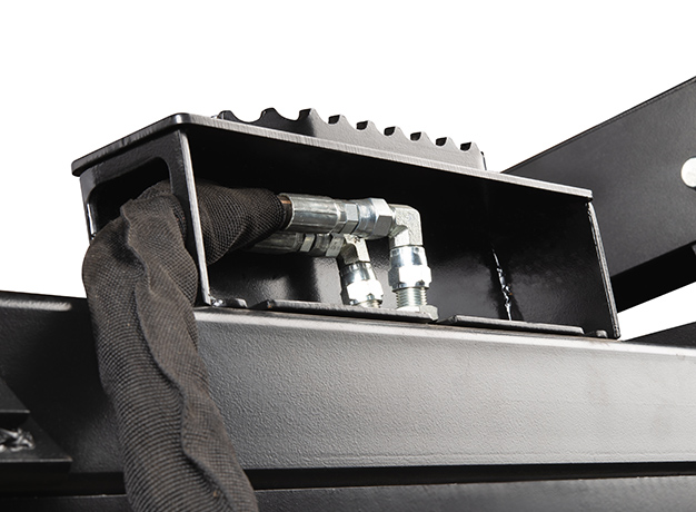 Steel covers and shields protect hydraulic lines