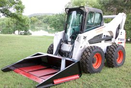 Versa Rake attached to skid-steer